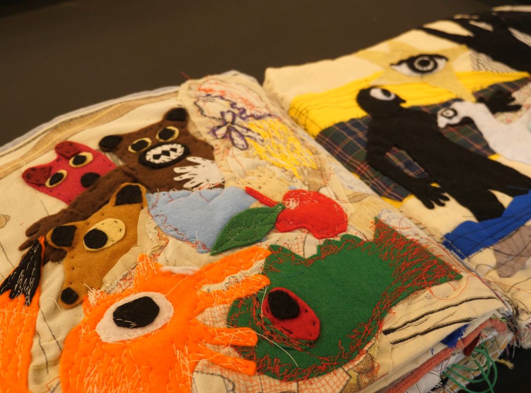 Embroidered book by Ann Marie Whitton An emboridered book showing an orange fox, brown bear and some other abstract creatures by Ann Marie Whitton